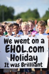 Premium Domain EHOL dot COM children holding a banner